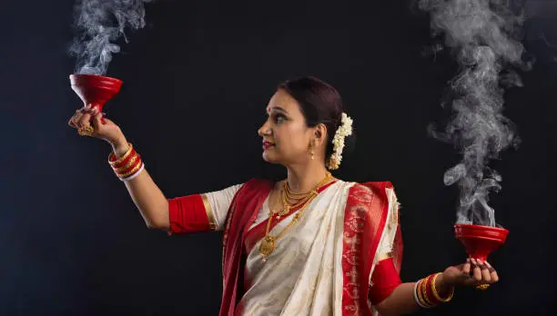 Photo of Portrait of Bengali woman holding a dhunuchi