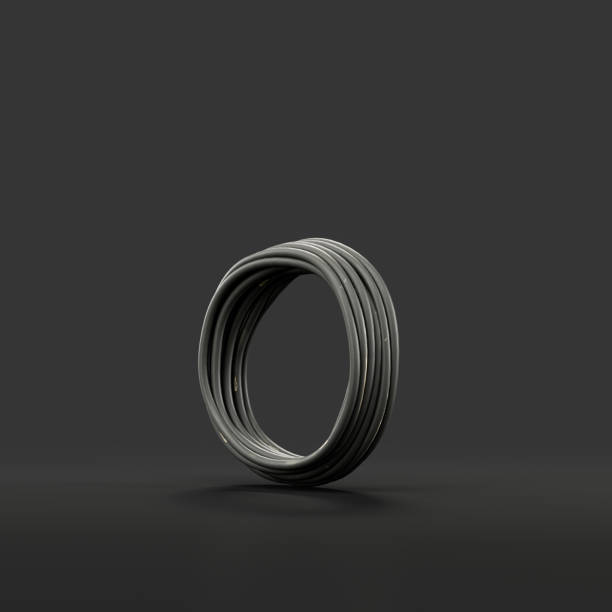 istock Black electric cable in roll isolated on dark background, 3d rendering 1415504014