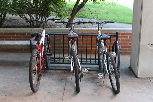 Parked bicyles at college campus