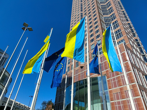 Frankfurt, Germany - April 24, 2022: Euro flag in Frankfurt and Ukrainian flag- Ukraine and Europe concept