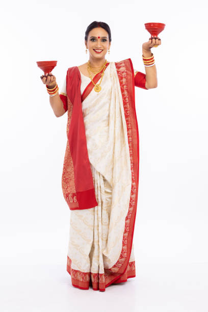 istock Woman holding dhunuchi over white background. 1415507510