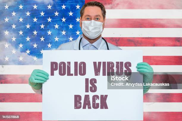 Inscription Polio Virus Is Backdoctor Holds Mockupdetection Of Poliomyelitis Virusnew Polio Virus Infects Dozens In Usaus Flag Background Stock Photo - Download Image Now