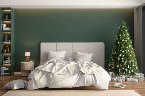 istock Modern Bedroom Interior With Christmas Tree, Ornaments, Gift Boxes And Messy Bed 1415514756