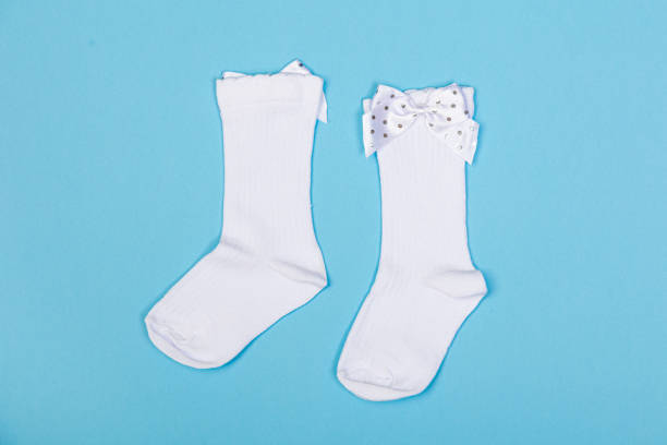 istock high white children's socks with big bows for festive clothes on a blue background 1415514910