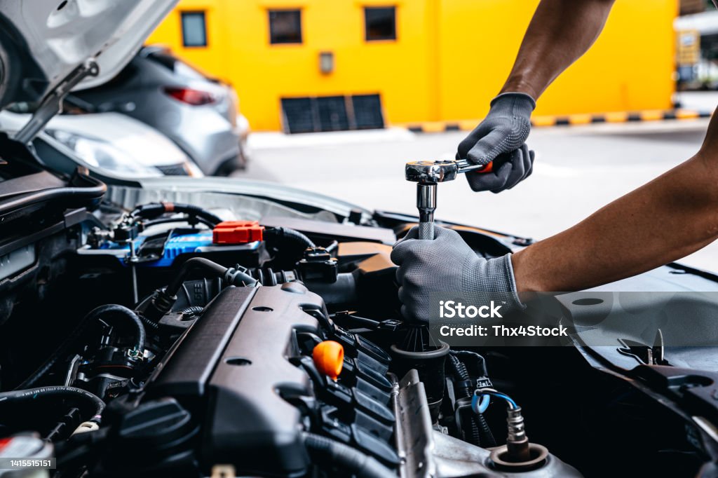 Mechanic Auto Mechanic Using Wrench While Working On Car Engine At Garage Workshop ...