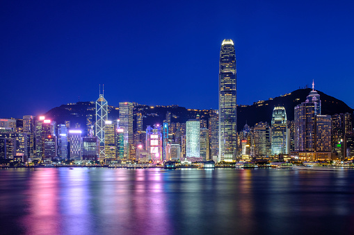 Famous night scenery of Hong Kong Victoria Harbour and skyline.