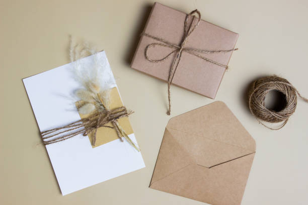 istock A letter concept with envelope and gift box and rope over the brown background. 1415515391