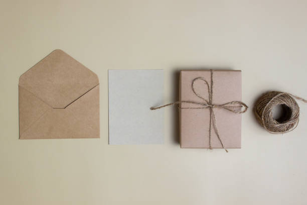 istock A letter concept with envelope and gift box and rope over the brown background. 1415515394