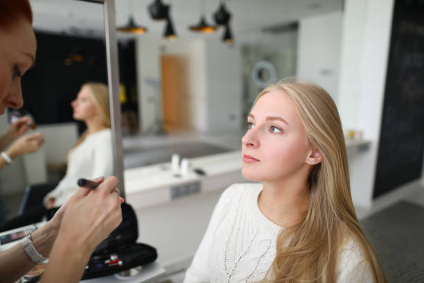 istock Female sitting in chair in saloon 1415516272