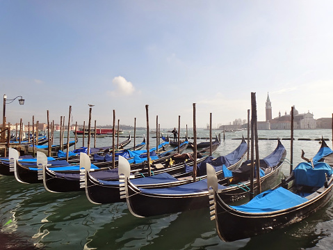 Moored gondolas and San Giorgio Maggiore in Venice, Italy