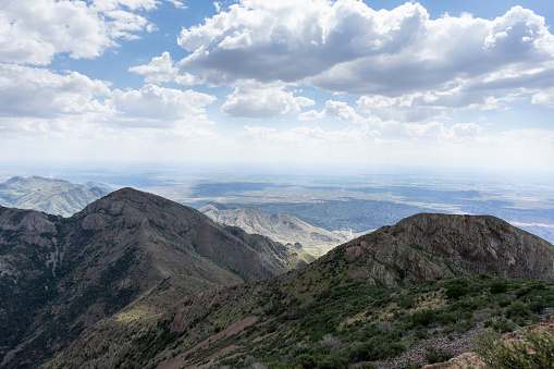 A view from Baldy Peak, looking south, toward El Paso, with Soledad Saddle in foreground, light and shadow