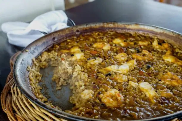 Photo of Arroz del senyoret, or senyoret rice, during its preparation it is essential that all the pieces of fish and seafood are clean, so that when serving it we do not find on the plate not even a shell.
