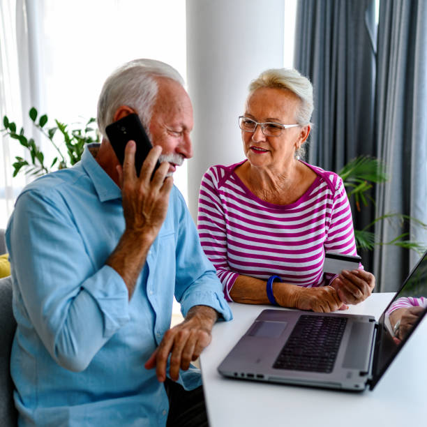 istock Senior couple using laptop at home. 1415528536