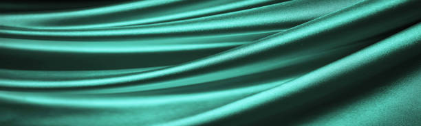 istock Light green blue silk satin. Turquoise elegant background with space for design. 1415529295