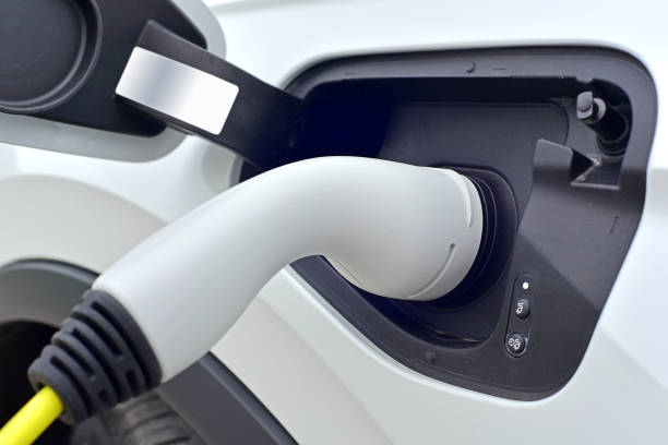 istock Connected charging connector to electric car 1415530571