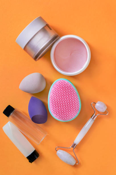 istock Cosmetic jars on orange 1415531961