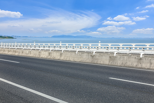 Asphalt highway and sea with skyline natural scenery