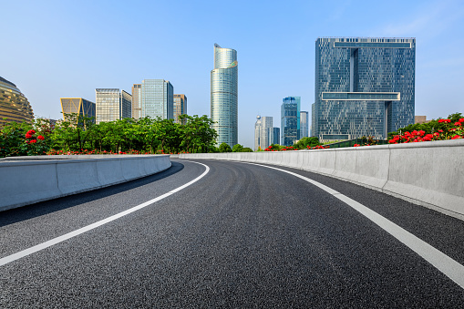 Asphalt highway and city skyline with modern buildings scenery in Hangzhou, China.