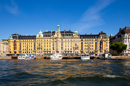 Buildings along Strandvägen and tourboats at Nybroviken in central Stockholm