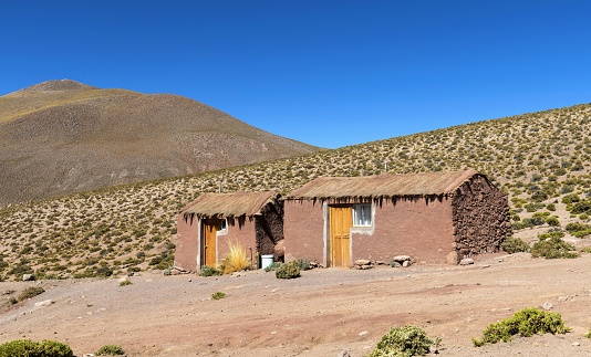 Machuca, Chile, December 4, 2018: View of two houses in this small Andean village at an altitude 4,000 meters above sea level on a sunny day.