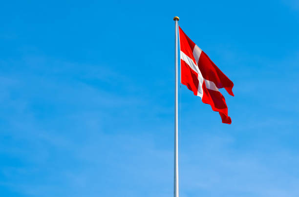 istock Danish National flag, Dannebrog on a flagpole. 1415535577