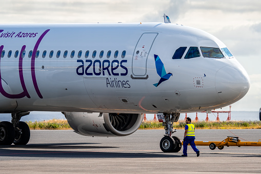 Ponta Delgada, Portugal - July 9, 2022: Azores Airlines Airbus A321-253NX - Peaceful on the runway of the airport. Airbus A321 with the Peaceful theme logo arriving to Ponta Delgada, Azores