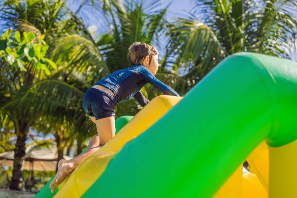 a boy falling into the water in the aquapark