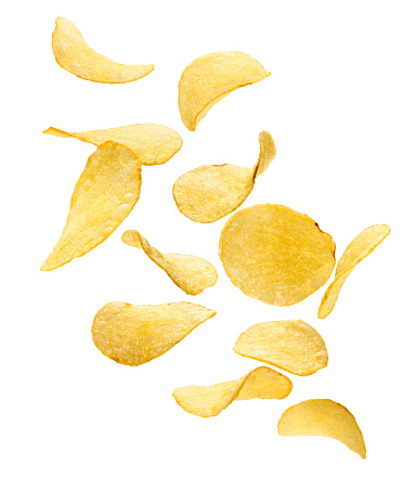 Flying crispy potato chips isolated on white background