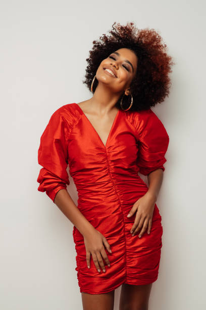 istock Beautiful smiling girl with curly hairstyle 1415545720