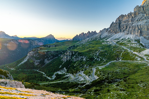 Aerial view of Italian alps - Drei Zinnen (Tre Cime di Lavaredo) against blue and cloudy sky.