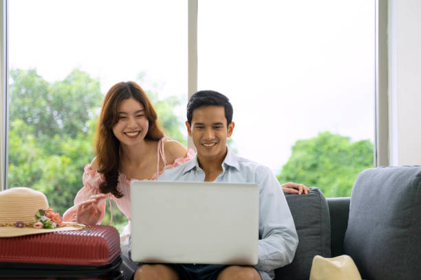 istock Young couple is preparing for travel. 1415547535