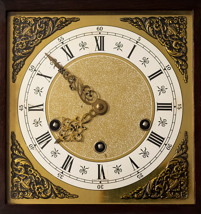 antique golden clock face close up