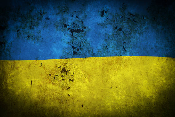 istock Flag Ukraine is depicted on an old, rusty, cracked surface. 1415552013