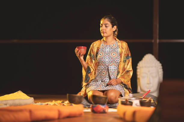 istock Young woman is having cacao ceremony. 1415553871