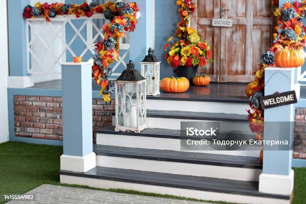 Halloween Design Home With Yellow Fall Leaves And Lanterns House Entrance Staircase Decorated For Autumn Holidays Fall Flowers And Pumpkins Cozy Wooden Porch Of The House With Pumpkins In Fall Time Stock Photo - Download Image Now