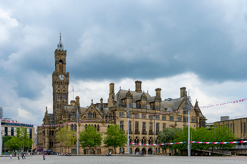 Bradford City Hall is a 19th-century town hall in Centenary Square, Bradford, West Yorkshire, England. It is known for its landmark clock tower and is a Grade I listed building.  It has bunting outside across the market square for Queen Elizabeth II platinum Jubilee.
