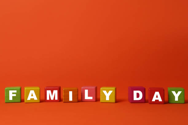 istock Colorful cubes with text Family Day on orange background 1415560647