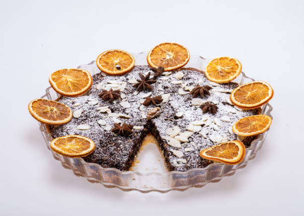 Tart with poppy seeds and fruit sprinkled with powdered sugar