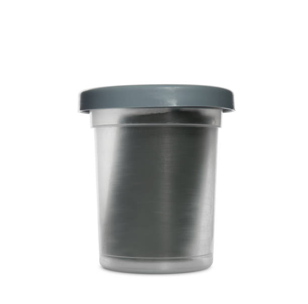 istock Plastic container of grey play dough isolated on white 1415563599