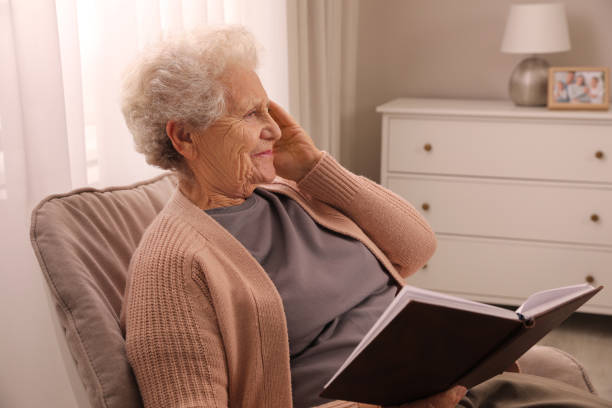 istock Senior woman with notebook at home. Age-related memory impairment 1415563611