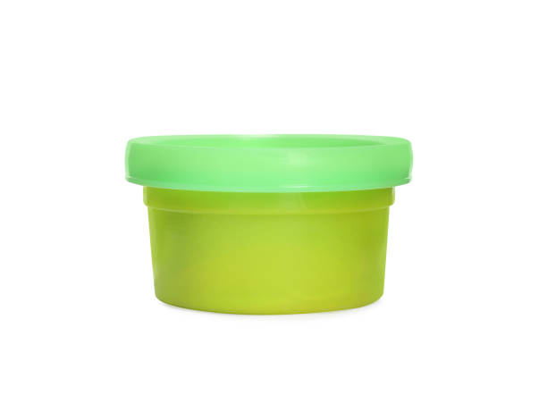 istock Plastic container of colorful play dough isolated on white 1415563621