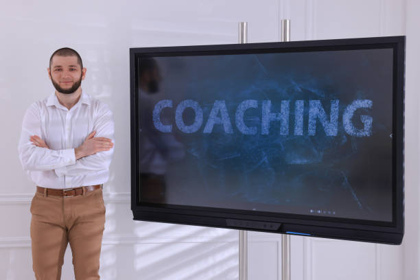 istock Business trainer near interactive board in meeting room 1415564288