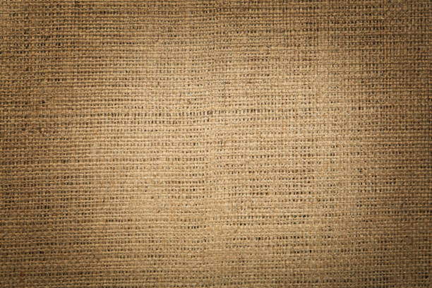 istock Texture of natural burlap fabric as background, top view. Vignette effect 1415565882