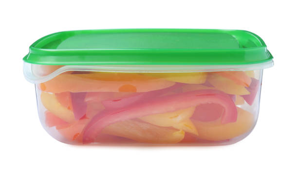 istock Fresh cut bell peppers in plastic container isolated on white 1415566094