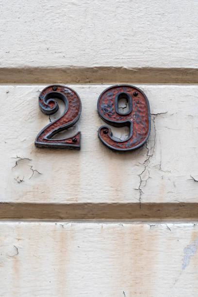istock Number twenty nine on white painted plaster wall 1415566462