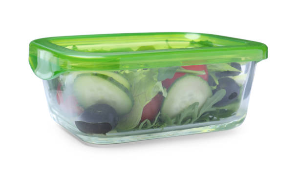 istock Tasty vegetable salad in glass container isolated on white 1415566475