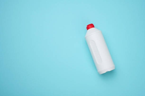 istock White plastic bottle for liquid on a blue background, top view 1415571910