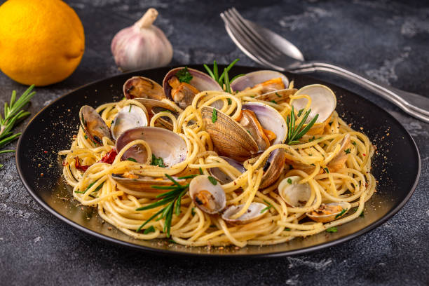 istock Seafood pasta with clams Spaghetti alle Vongole on a light background 1415572007