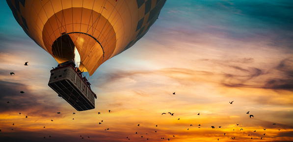 Aerial view of a European landscape from a hot air balloon with a loving couple, 3d render with photo element.