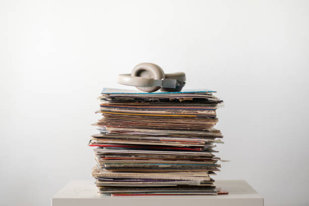 istock vinyl music records stack on the shelf with headphones on top 1415573641